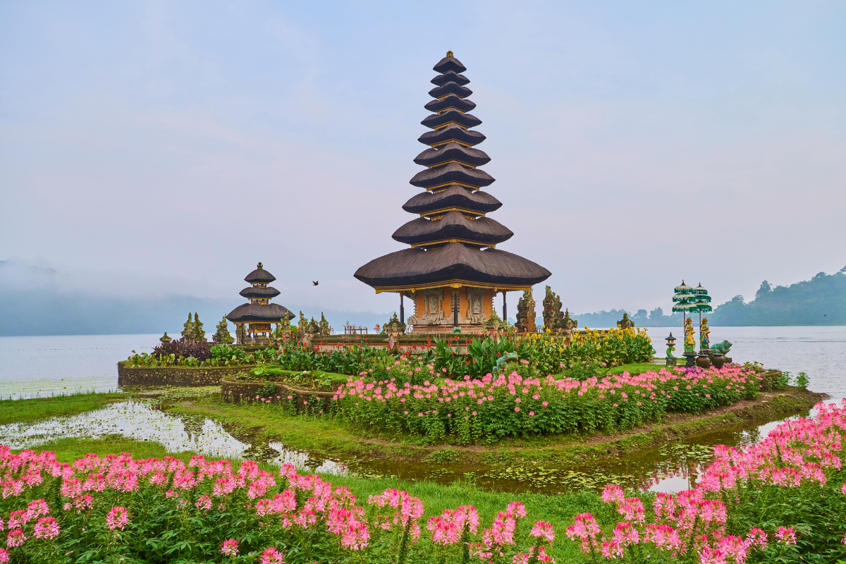 Ulun Danu Beratan Temple surrounded by lake water and flowers